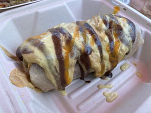 Queso smothered breakfast burrito at Whyld's Vegan Kitchen in Austin