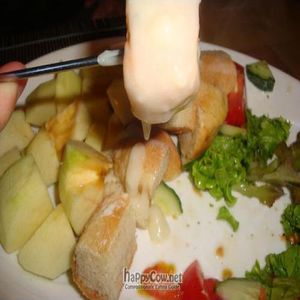 cheese fondue with bread and apples at Bistro Artesana Groovy in Helsinki