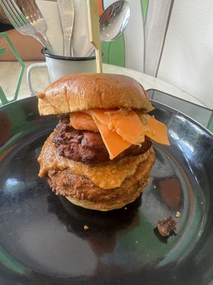 Signature Crispy No Frickin Chicken, Butta ‘Chicken’ Sauce, Bhaji, Mango Chutney & Pickled Carrot in a Brioche-Style Bun  at No Frickin Chicken in Worcester