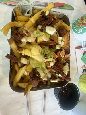 Loaded fries. Facon steam strips and pop corn no chicken   at No Frickin Chicken in Worcester