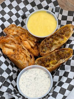 Buffalo chicken with gnarlys ranch & steak with classic cheese  at Buddy's Steaks in Portland