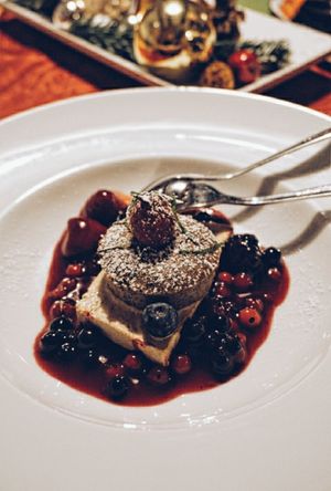 Zimtparfait mit Mohnküchklein und Beeren at Gasthaus Bürgerstüble in Sankt Peter