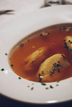 Klare Tomatenessenz mit Polentanocken at Gasthaus Bürgerstüble in Sankt Peter