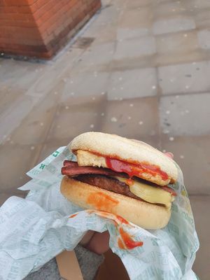 Shack muffin (Sausage style patty, Fried Tofu, slice of cheese topped off with Ketchup) added bacon style rashers at Vegan Shack - Piccadilly Gardens in Manchester