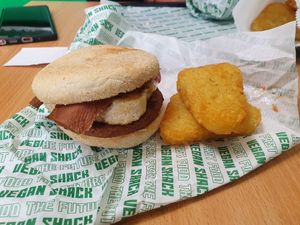 Breakfast muffin with bacon and hash browns at Vegan Shack - Piccadilly Gardens in Manchester