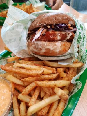 Nashville hot chick'n burger with house fries and sriracha mayo at Vegan Shack - Piccadilly Gardens in Manchester