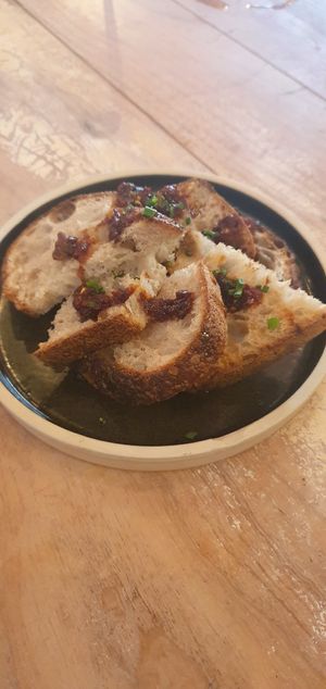 Bread Oil: Toasted sourdough bread (Pollen's bakery) + fermented chilli oil at Vegan Shack - Piccadilly Gardens in Manchester