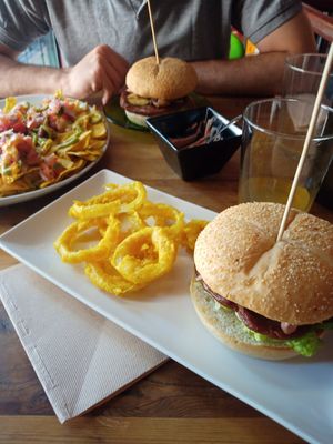 Mediterranean hamburger (amazing blue cheese sauce!), Huge nacho plate at La Pajareria in Madrid