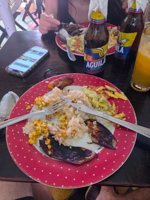 Veggie plate half eaten lol sorry. But eggplant, coconut rice, corn, avo salad and plantain. at Mama-Nilma in Cartagena