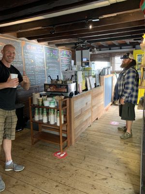 Owner Matthew on the left. Juice bar offering with grass and many different juices and smoothies, all organic   at Feelin O2 Good in Southampton