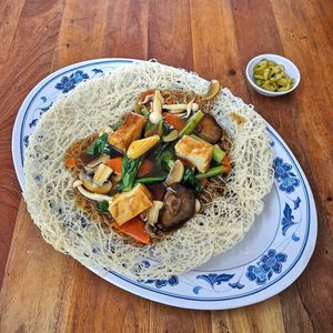 Crispy Beehoon 香底米粉  - Beehoon is fried until crispy with thick gravy over vegetables, mushrooms, tofu, etc.

Ask for the eggless version to veganise it. at Nature Vegetarian Delights 大自然素食 - Bukit Purmei in Central Singapore