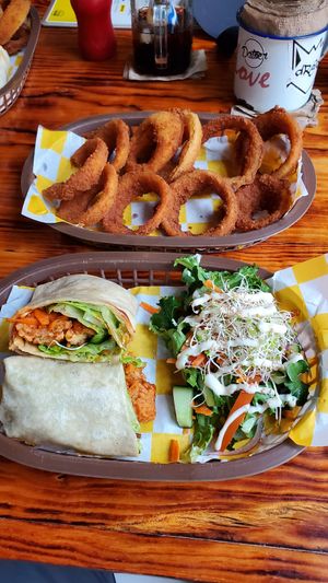 Wrap and onion rings. at Crush in Merida