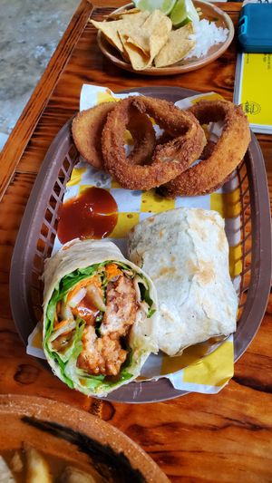 Wrap comes with rings, potatoes or salad. at Crush in Merida