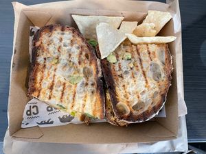 Toasted sourdough, grilled tamari tofu, avocado, tomato, spinach, hummus, vegan smokey mayo & dukkah. Small side of homemade chips. at Cali Press in Double Bay