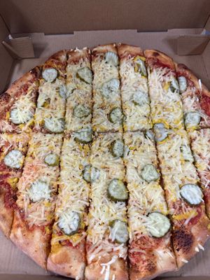 All vegan cheeseburger on QC style crust is quickly becoming a customer favorite!!!!  Try one today!   It does have a light mustard and dill pickle!    at Top Hat Pizza in Moline