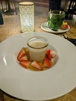 Vegan panna cotta with mango puree and strawberries at Grand Café Klunder in Alkmaar