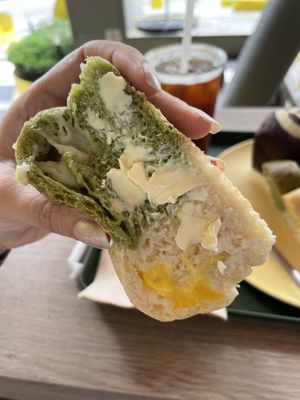 Spinach bread with vegan cheese filling and vegan butter on top   at Vegan Veganing in Seoul