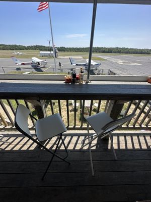 Bar seating on the deck  at Hangar B Eatery in Chatham