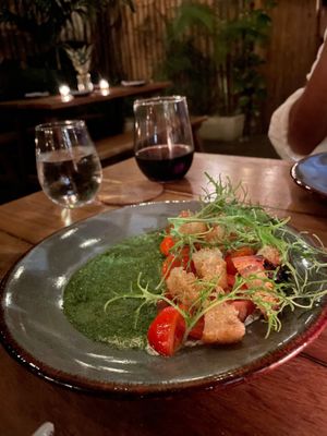 Vegan house made cheese with pesto and croutons. Red wine. at Pizza Papi in Tulum