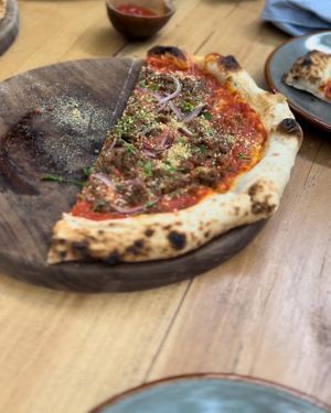 Beyond Italian sausage. This was my favorite and BTW the crust at Papi is the best I’ve ever had!  at Pizza Papi in Tulum