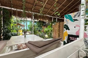 Shaded outdoor dining area  at Pizza Papi in Tulum