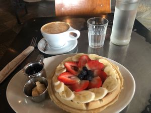 Waffles with fruit and latte at Freesoulcaffe in Tustin