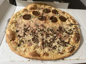 Half pepperoni and green pepper, half sausage and mushroom with vegan cheese  at Dante's Pizzeria in Chicago