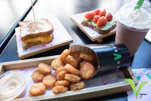 Avocado toast, tater tots, bacon egg & cheese & chocolate shake at SoBe Vegan in Miami Beach