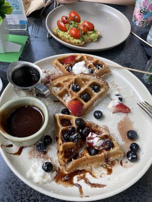 Waffles - asked for chocolate sauce. In background- avocado toast  at SoBe Vegan in Miami Beach