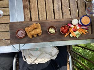 Vegan menu - not pictured is the fruit salad for dessert! On the left are “nuggets” made of carrots and seitan, on the right veggies to dip with a delicious garlic/tomato dip! at Maison Joseph in Carcassonne