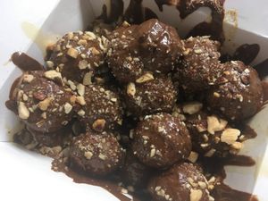 Praline, dulce de leche and salted almonds loukoumades at Keenkies in Athens