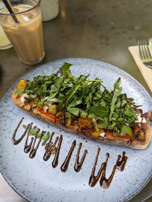 Bruschetta with vegan cheese, Mediterranean veggies and balsamic dressing; and Soya iced latte at Cafe 53 in Tetbury