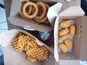Onion rings, nuggets and waffle fries at A Burgers in Nancy