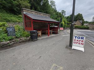 More outside seating, covered. It's the old bus stop. at The Tor Cafe in Cromford