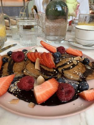 Gluten free pancakes with lots of berries and yogurt   at Linnaean in South West London