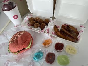 Ordered by Grab delivery: The classic S.S.B.D burger with wedges, Dutch “better” balls and a mixed berry smoothie  at I'm Your Vegan in Chiang Mai