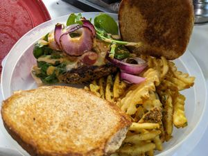 House made black bean burger with waffle fries at Kales Kitchen  in Houston