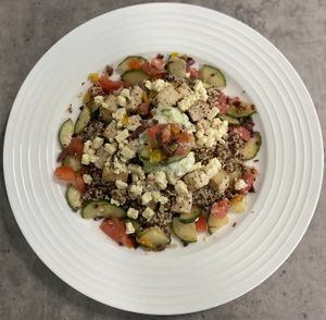 Greek seasoned, marinated and baked Tofu, served over a lemon dill seasoned quinoa and topped with a side of cashew-based taziki sauce and greek salsa. at P2F Meals in Fort Myers
