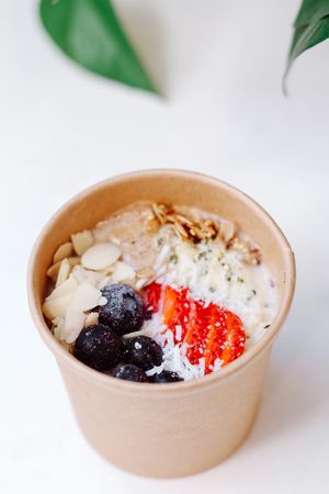 WARM GRANOLA
house granola with steamed almond mylk, almond butter, fresh fruit, hemp hearts, sliced almonds, and coconut at Plant Lyfe in Toronto