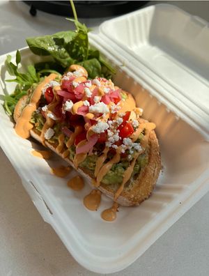 THE GEM LOADED TOAST
smashed avocado with cherry tomato, cilantro, cumin, and lime; topped with housemade pickled onions, dukkah, feta, chipotle cashew créma, and red chili flake at Plant Lyfe in Toronto