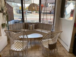 Indoor seating area with swings at Drift Cafe in Newport