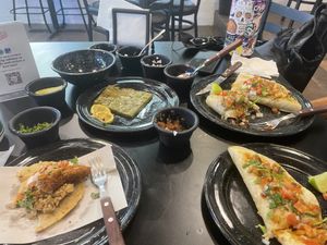 Our table stocked full of salsas and toppings  at Los Paradise in Playa Del Carmen