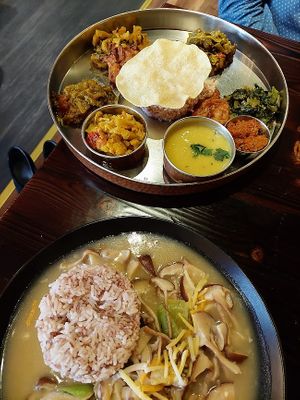 Veg thali sampler platter and Bhutan mushroom datsi with red rice at Norbu in Lancaster