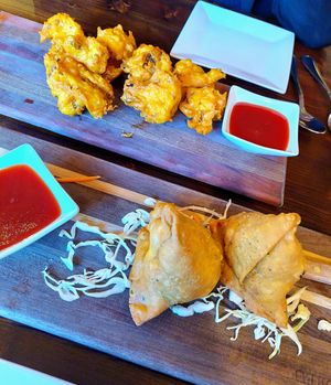 Cauliflower pakoras and (forgot what they called them) samosas. Delicious! at Norbu in Lancaster