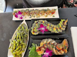 Red Dragon Roll, Dragon Roll, Volcano Roll, & Spicy Garlic Edamame. at Vegan Castle in Long Beach