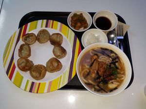 Udon, side dishes, and fried dumplings at Loving Hut - Rodeo in Daegu