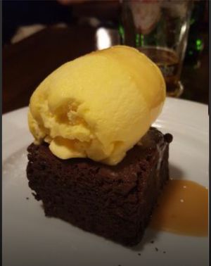 Homemade chocolate brownie with vanilla ice cream and caramel  at Bounty  in Sibenik