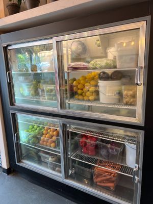Part of the decor is a big huge fridge that shows you exactly what's going into your food. Regularly during our stay, cooks would come pick fresh produce... at Root 2 Rise in Pleasantville