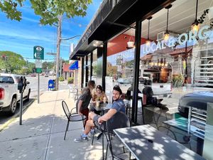 R2R Entrance with visitors from Colorado enjoying the views of Pleasantville NY. Yo! Really lovely small town friendly shopping vibes and a very cool bike shop is close bt. at Root 2 Rise in Pleasantville