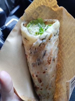 Delicious wrap stuffed with healthy sprouts and greens at Loving Hut 愛家 in Jian